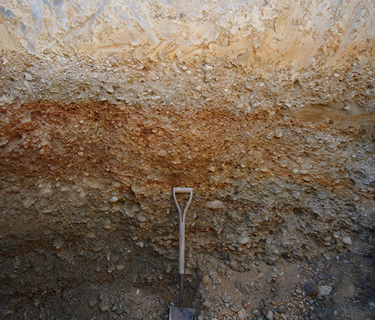 Gravel layer exposed in soil pit.