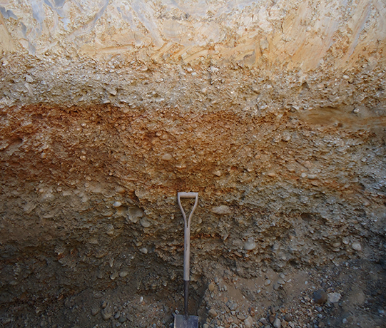 Gravel layer exposed in soil pit.